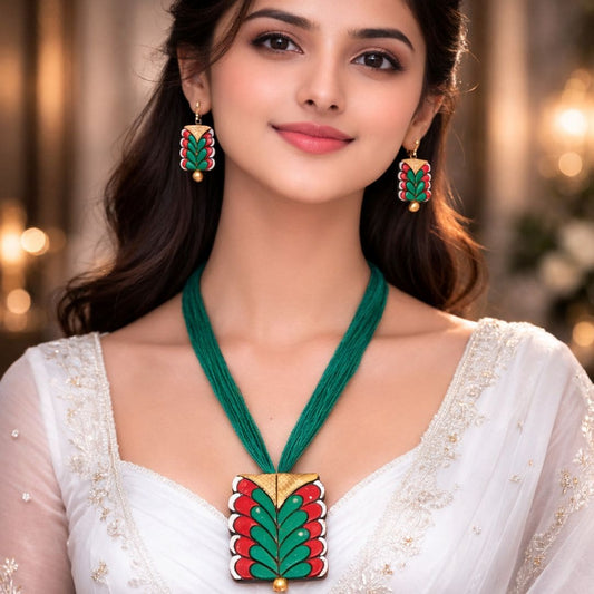 HEZEL green and red enamel necklace with matching earrings worn by female model in elegant traditional attire