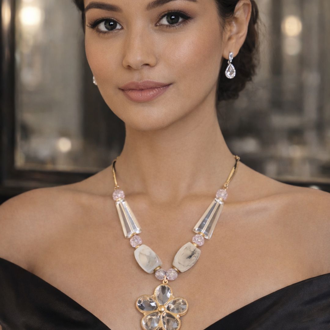 HEZEL elegant crystal necklace with floral pendant and matching drop earrings, styled in a luxury look.