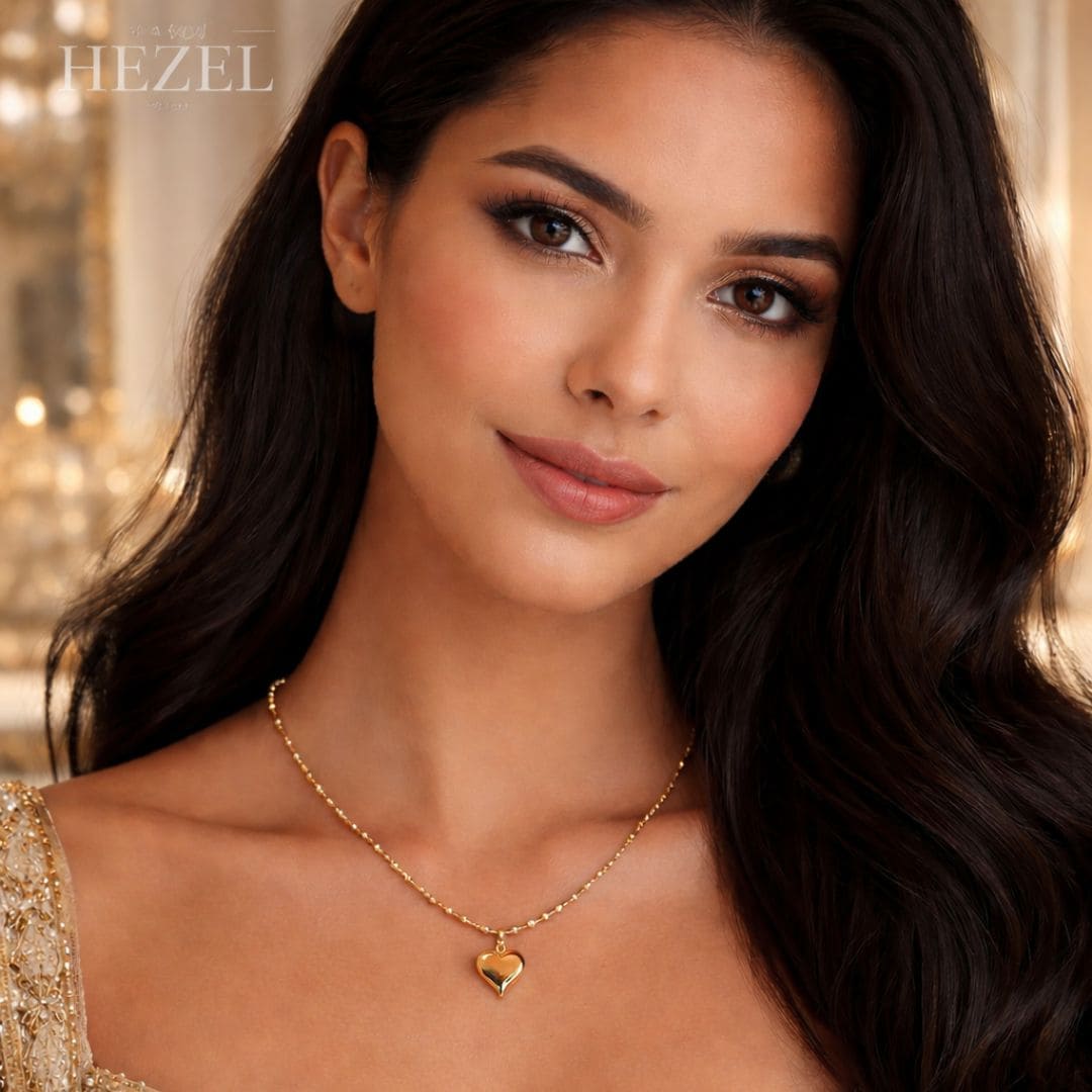 Model wearing HEZEL gold heart pendant necklace, elegant minimal jewelry with a soft romantic look