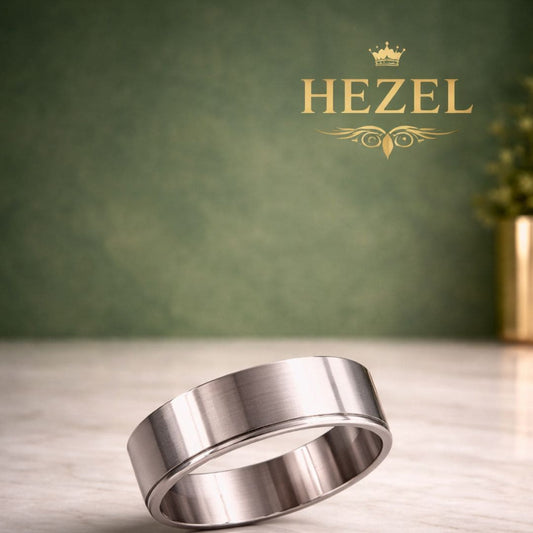 HEZEL minimalist brushed silver band ring with smooth finish on marble surface with premium green gradient background