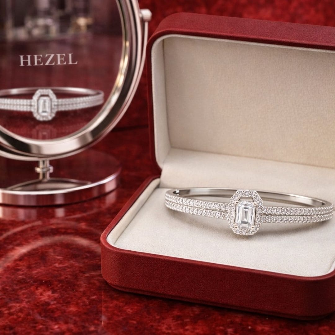 Luxury silver diamond bracelet displayed in elegant red jewellery box with premium reflective background for Hezel Jewellery.
