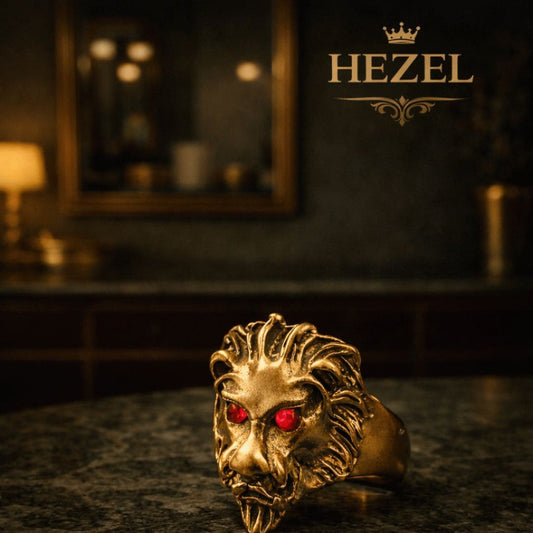 HEZEL bold lion head statement ring with red stone eyes in antique gold finish on dark luxury background