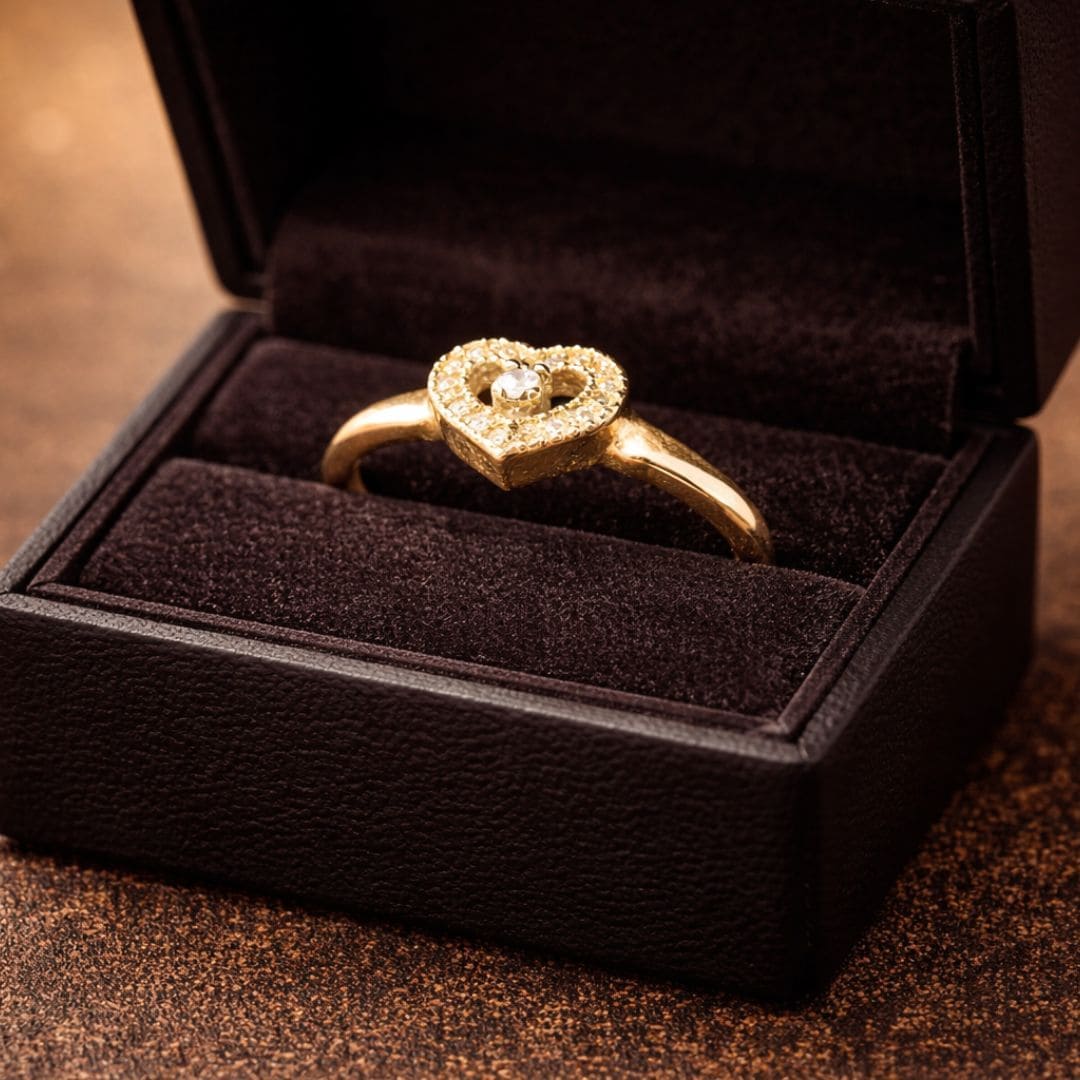 Hezel gold heart ring with center stone and halo design in luxury jewellery box