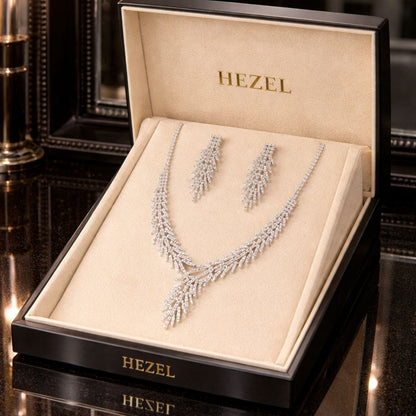 Hezel elegant silver crystal necklace and matching earrings jewelry set displayed in premium luxury gift box for bridal, wedding, and party wear