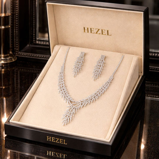 Hezel elegant silver crystal necklace and matching earrings jewelry set displayed in premium luxury gift box for bridal, wedding, and party wear