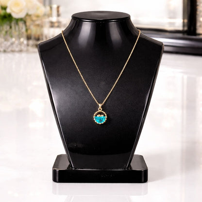 HEZEL elegant blue stone pendant necklace on black display bust with luxury vanity background