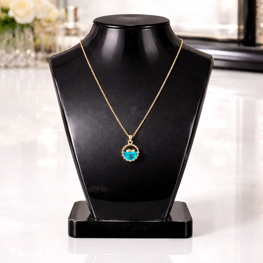 HEZEL elegant blue stone pendant necklace on black display bust with luxury vanity background