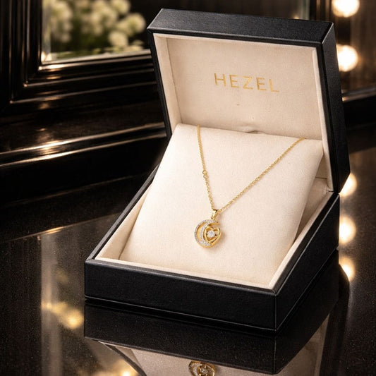 Hezel gold heart pendant necklace in premium jewelry box, elegant gift-ready luxury accessory