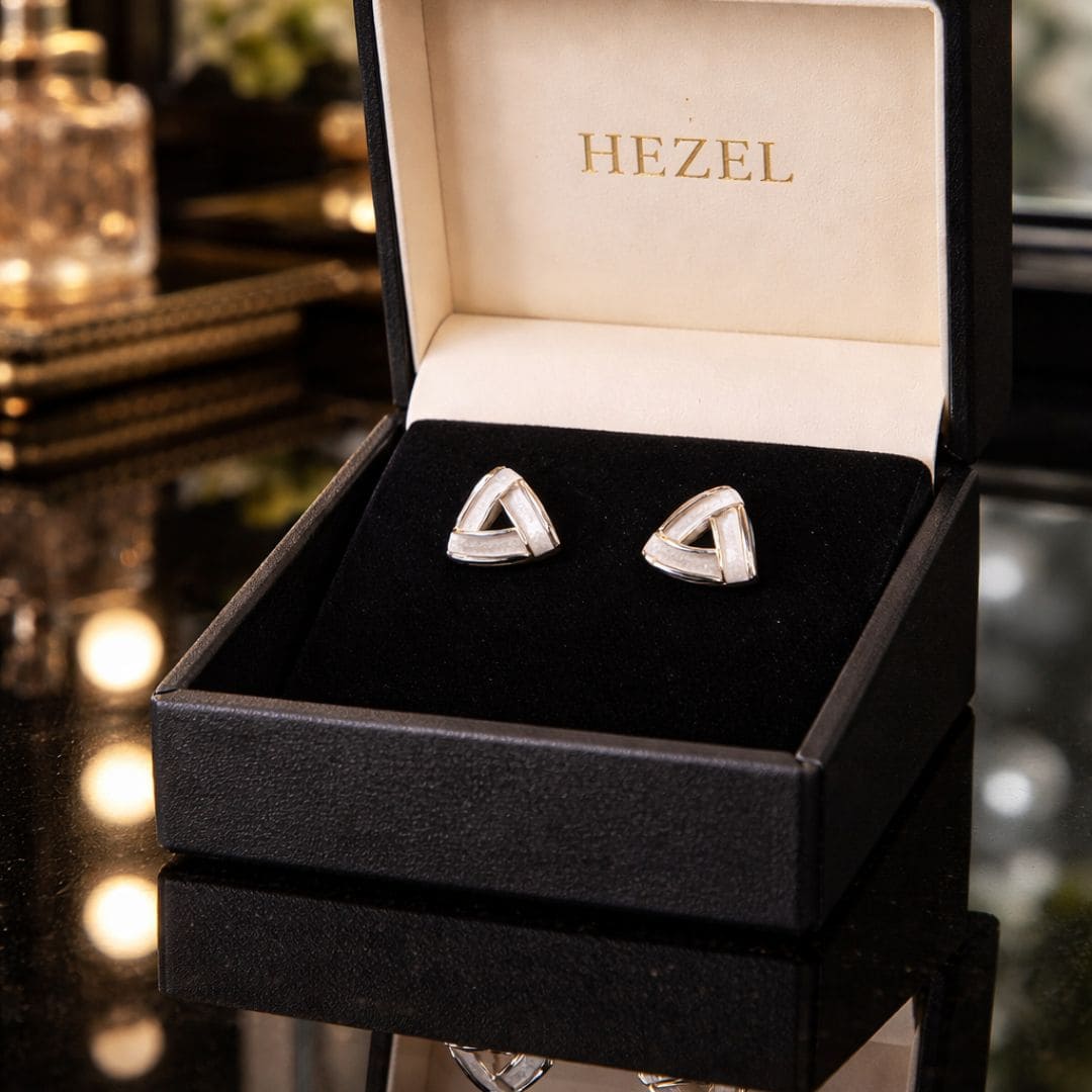 HEZEL geometric stud earrings in a premium black velvet jewelry box, elegant gold and white design