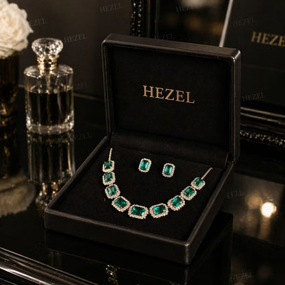 Elegant HEZEL statement necklace featuring rectangular green gemstones with halo crystal setting, paired with coordinating earrings