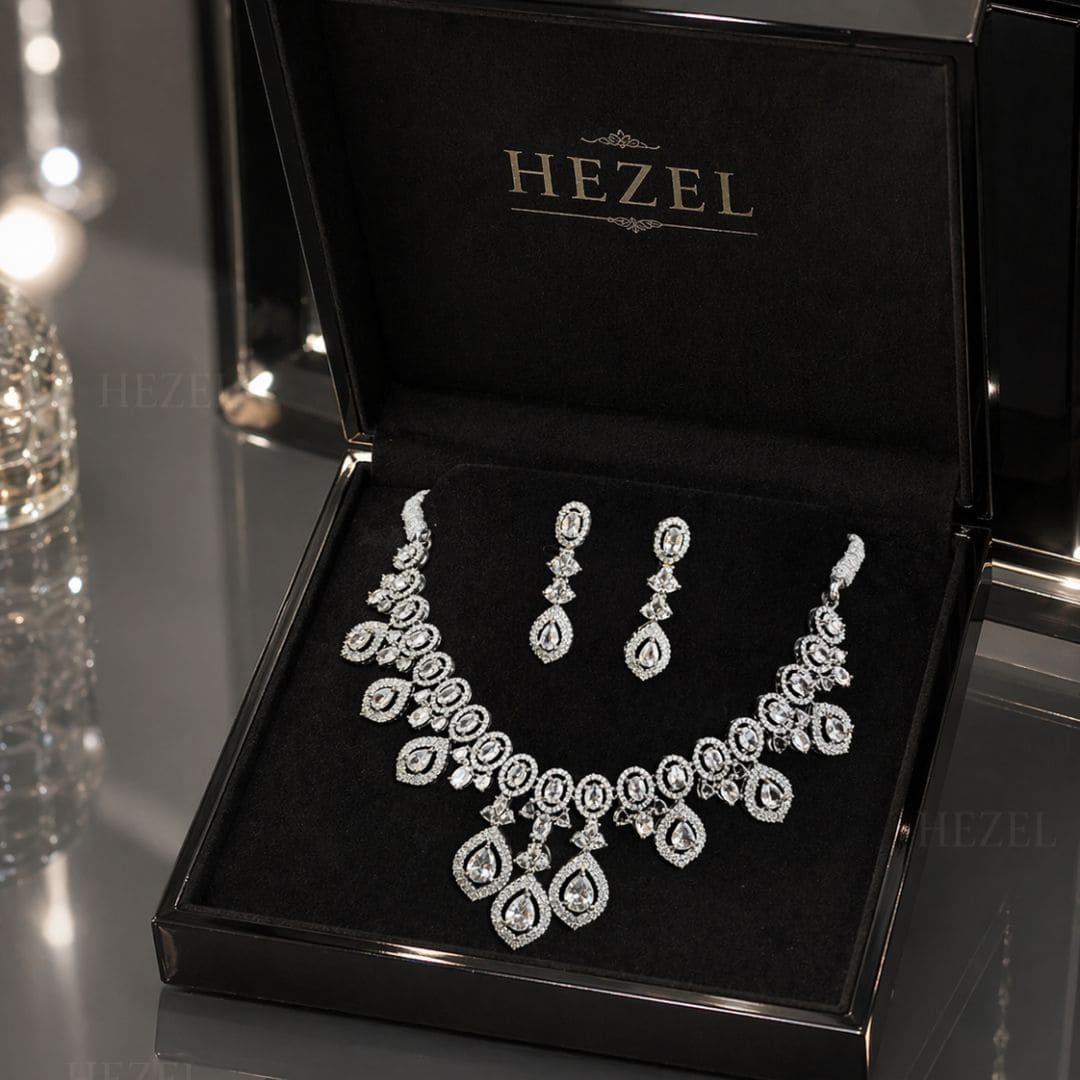 Jewelry set including a necklace and earrings in a black HEZEL box.