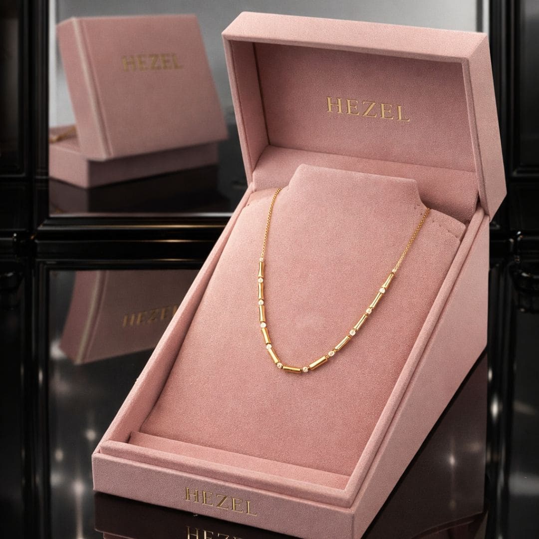 Minimal gold chain necklace in a premium HEZEL pink box, elegant and timeless everyday style.
