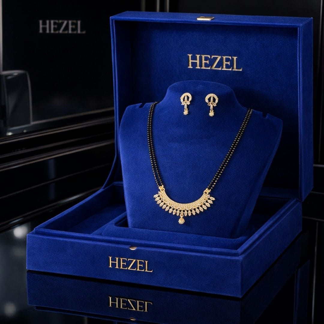 luxury jewellery presentation for Hezel featuring an elegant mangalsutra set in a premium royal blue velvet box with sophisticated high-end display aesthetics