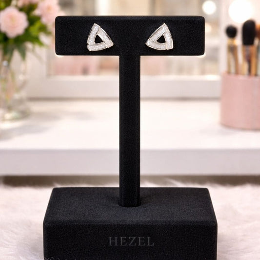 Model wearing HEZEL geometric stud earrings, elegant triangular design with a premium finish