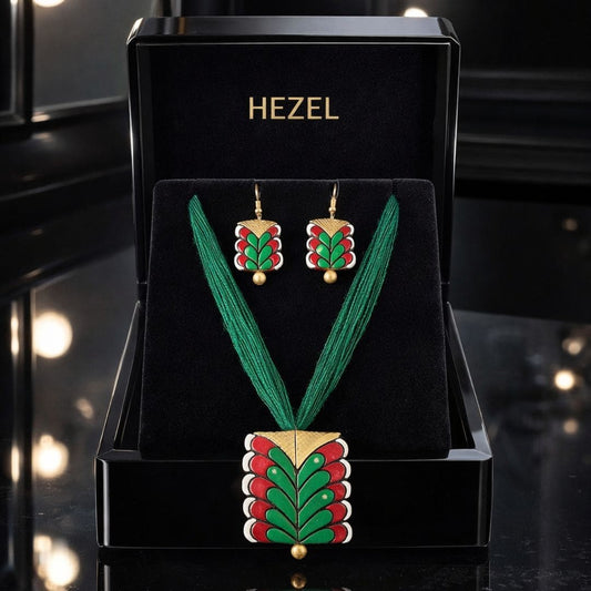 HEZEL handcrafted necklace and earring set with green and red enamel design displayed in premium black jewelry box
