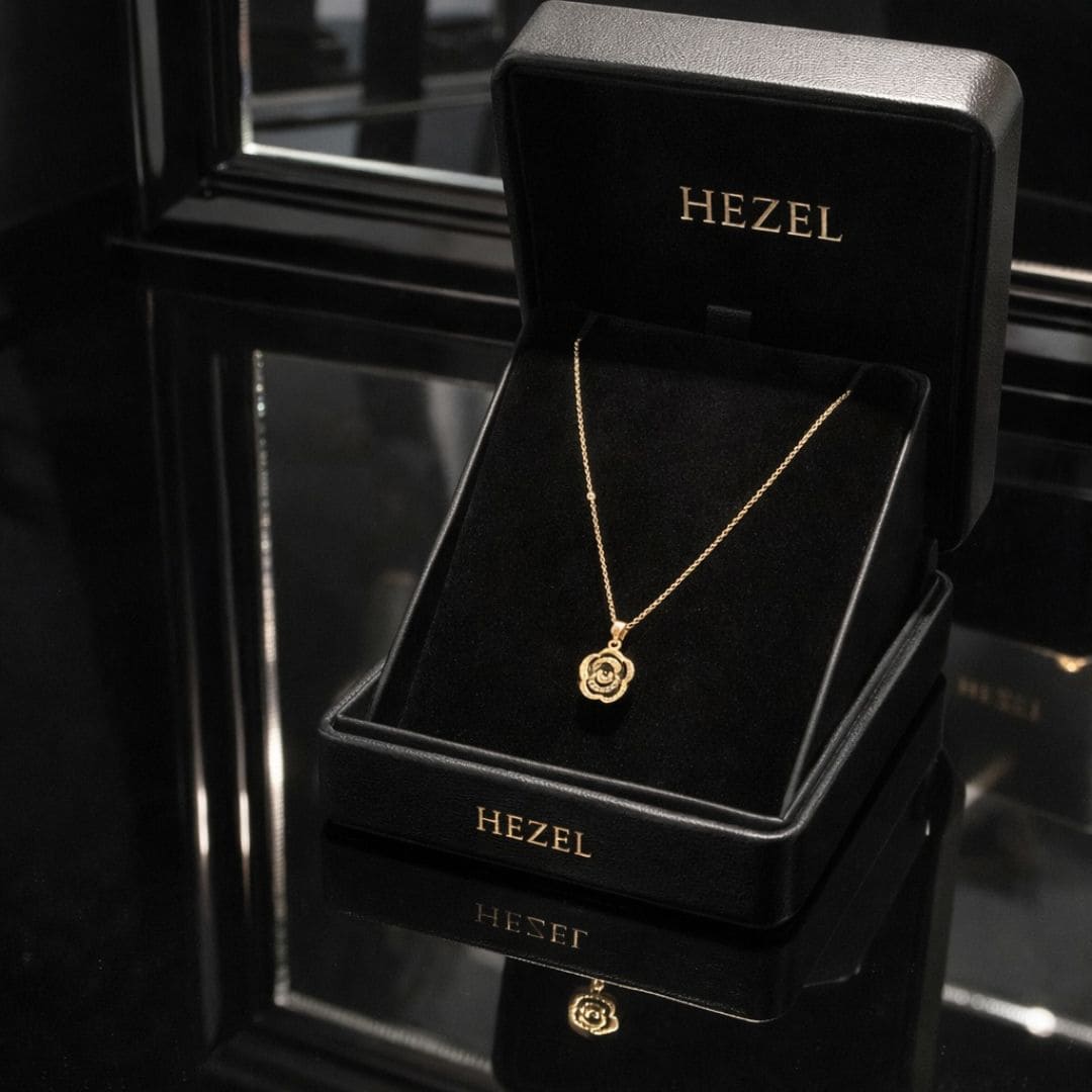 Hezel gold pendant necklace with floral design displayed in premium black jewelry box