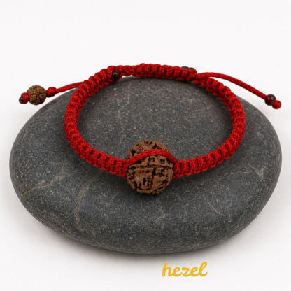 HEZEL rudraksha bracelet with red braided thread on smooth black stone