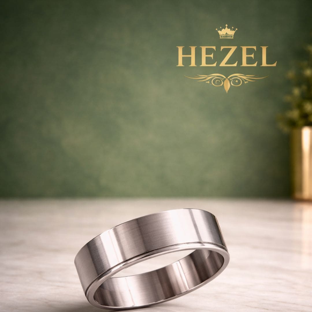 HEZEL minimalist brushed silver band ring with smooth finish on marble surface with premium green gradient background