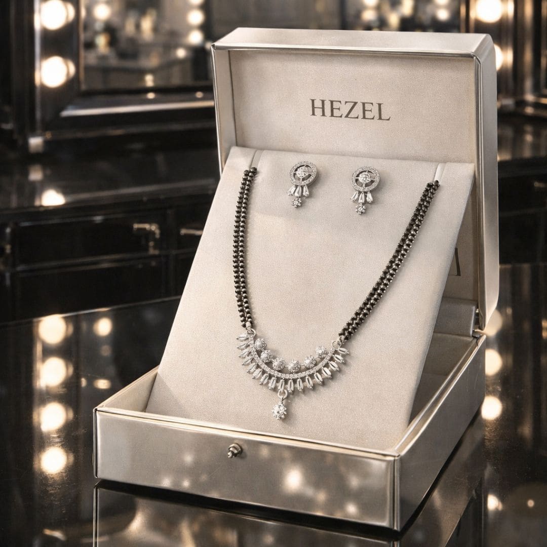 Premium silver-tone mangalsutra set with matching earrings displayed in an elegant HEZEL jewelry box