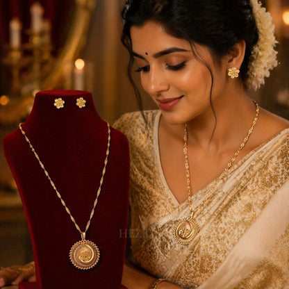 Model wearing HEZEL gold statement pendant necklace with matching stud earrings, traditional festive jewelry design