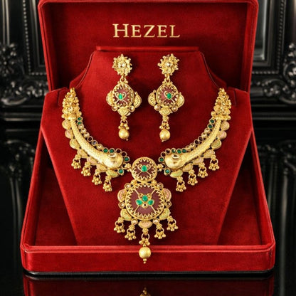 HEZEL gold-tone necklace set with green stone detailing and matching earrings in a premium red jewelry box