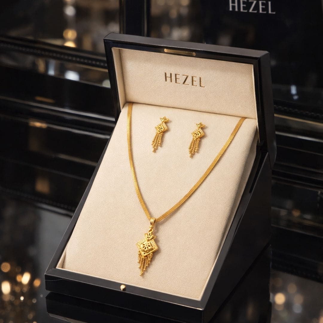 HEZEL luxury gold pendant necklace and earrings set displayed in premium black jewellery gift box