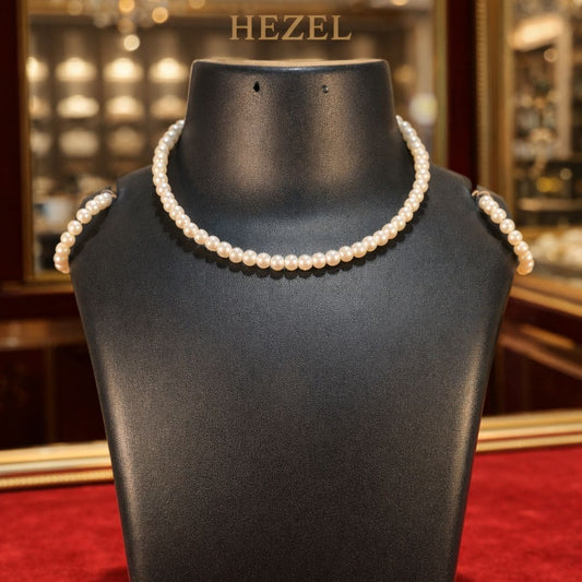 Hezel classic pearl necklace set displayed on black bust, elegant minimal jewellery design