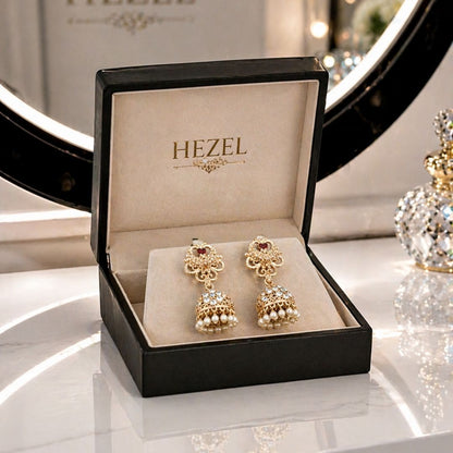 Elegant HEZEL traditional jhumka earrings featuring pearl accents and fine craftsmanship, displayed in a premium signature box