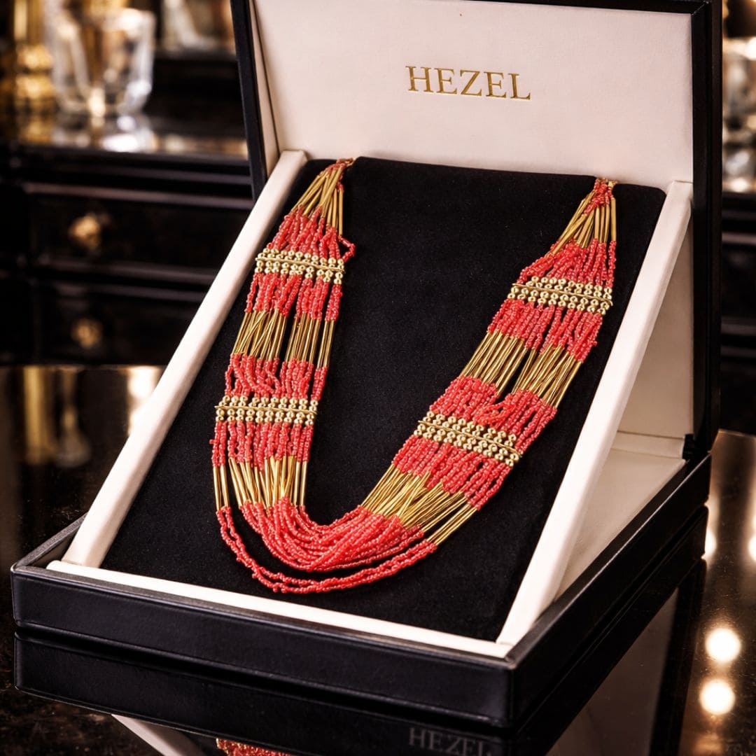 Hezel handcrafted red bead and gold layered statement necklace displayed in premium luxury gift box for elegant traditional and festive wear.
