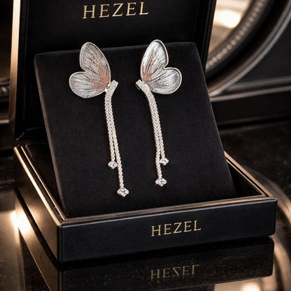 Hezel butterfly long drop earrings with crystal detailing in luxury jewellery box