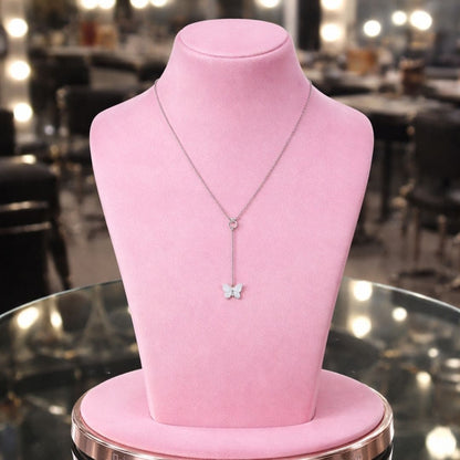 Hezel butterfly pendant necklace displayed on elegant pink premium jewelry stand.