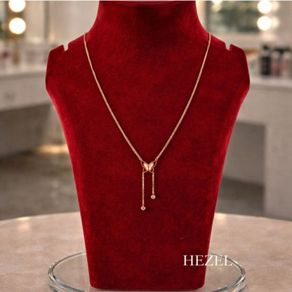 Hezel elegant butterfly pendant necklace displayed on premium red velvet stand