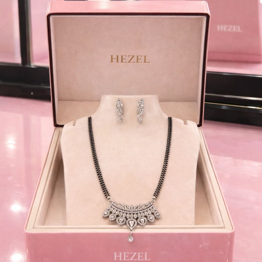 HEZEL jewelry display with necklace and matching earrings in a luxury pink box.
