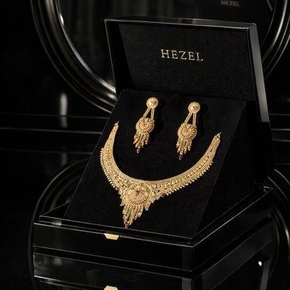 HEZEL premium gold-tone necklace set with matching earrings, elegantly presented in a luxury black jewelry box.