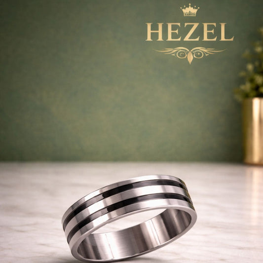 Hezel silver band ring with black stripes on marble surface with green luxury background