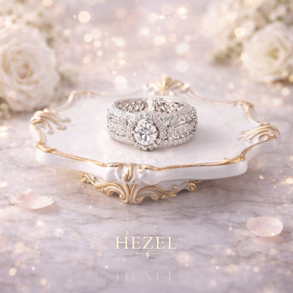 HEZEL diamond-studded statement ring with central stone, elegantly displayed on a luxury marble tray.