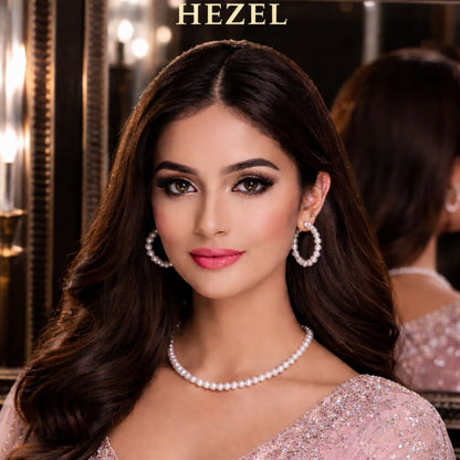 Hezel pearl necklace and hoop earrings set on model in elegant pink outfit, luxury jewellery look