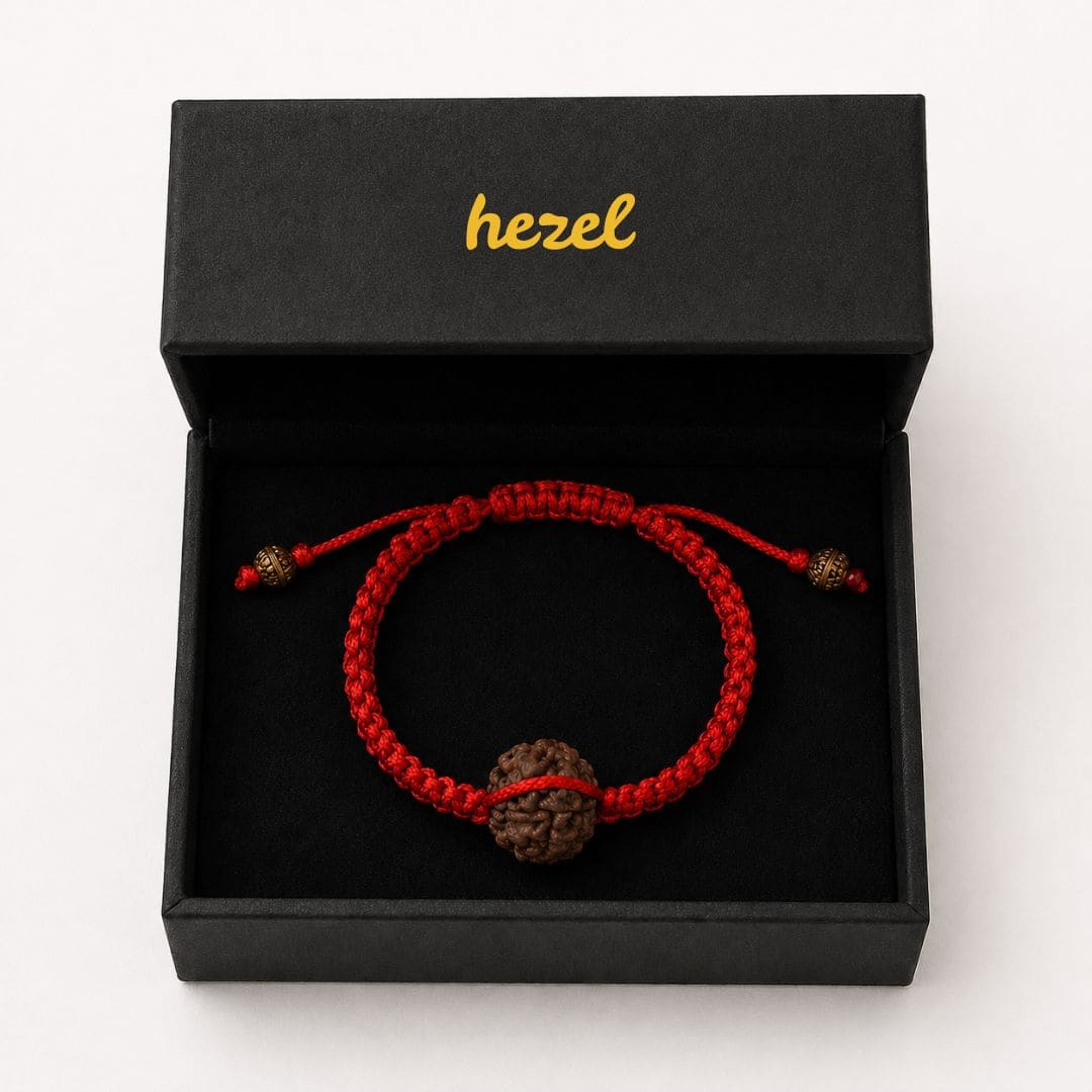 Close-up of HEZEL rudraksha bracelet featuring natural bead and handcrafted red braided cord