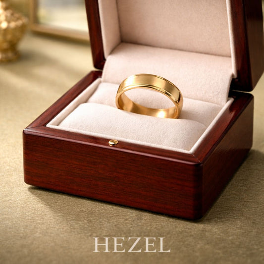 HEZEL luxury gold band ring presented in an elegant wooden jewelry box with soft velvet interior, showcasing a classic and timeless design.