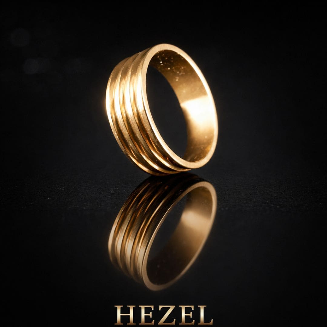 HEZEL gold band ring with multi-groove design on reflective black surface in premium luxury setting