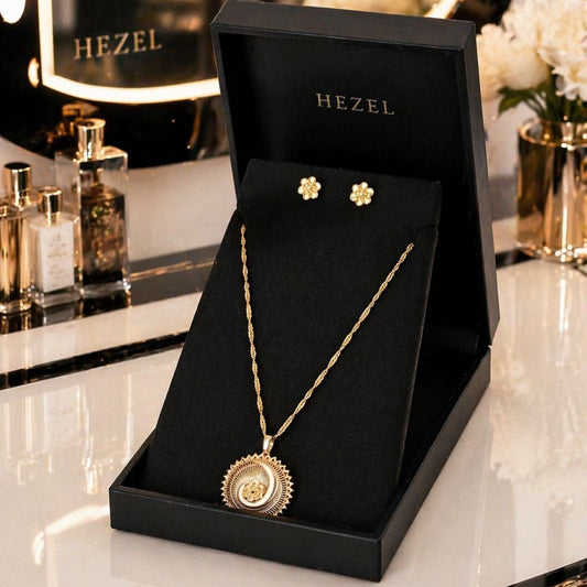 HEZEL gold statement pendant necklace with matching stud earrings in a luxury black jewelry bo
