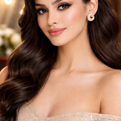 Model wearing HEZEL gold crystal stud earrings with elegant party and bridal look