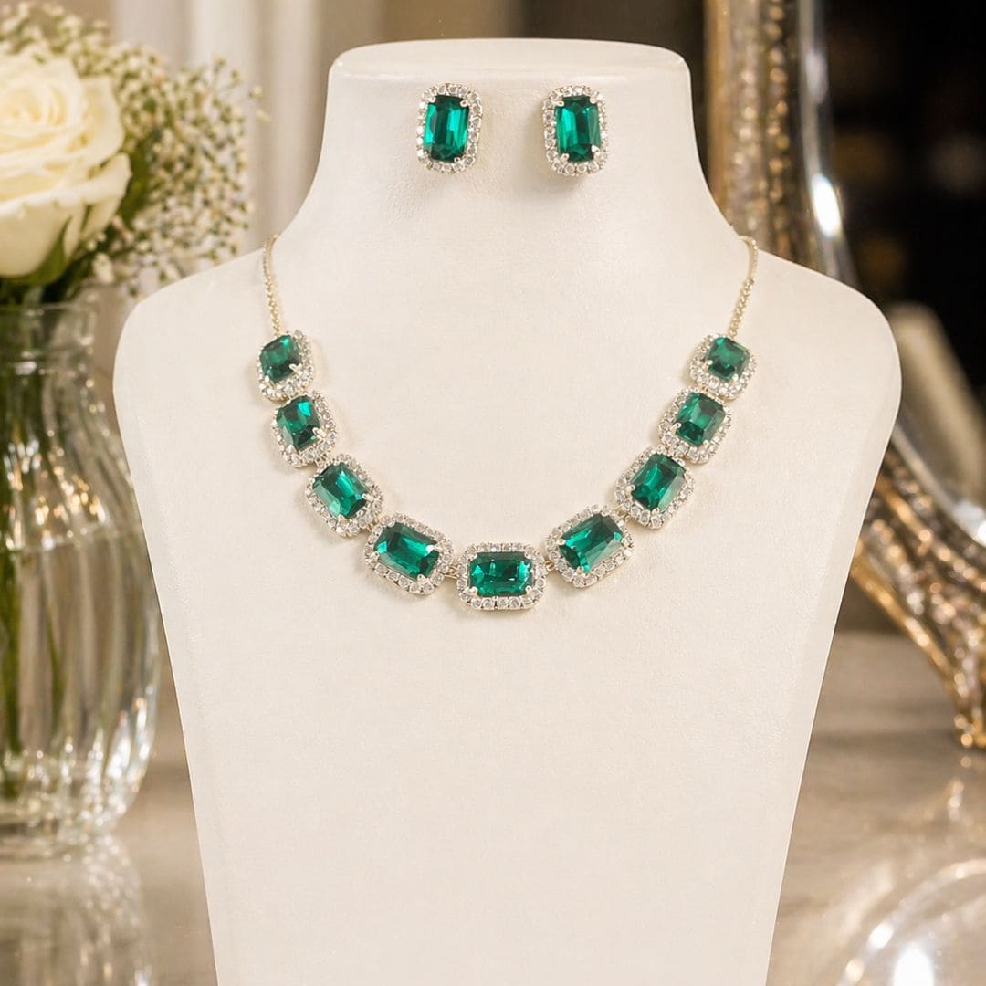 HEZEL emerald green stone necklace set with matching stud earrings, accented with crystal detailing and displayed on a white jewellery bust