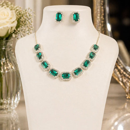 HEZEL emerald green stone necklace set with matching stud earrings, accented with crystal detailing and displayed on a white jewellery bust