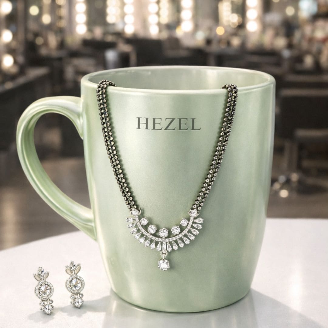 HEZEL elegant black bead mangalsutra set with sparkling pendant and matching earrings displayed on premium mug stand