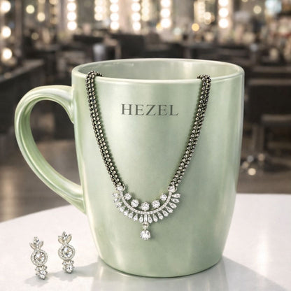 HEZEL elegant black bead mangalsutra set with sparkling pendant and matching earrings displayed on premium mug stand