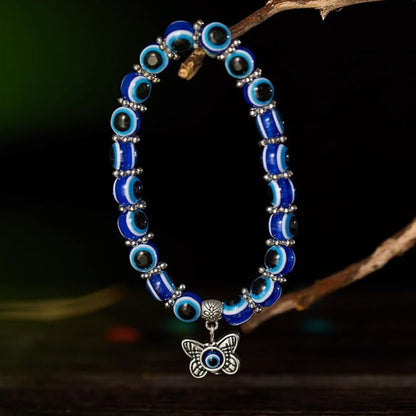 Blue Evil Eye Beaded Stretch Bracelet With A Butterfly Charm