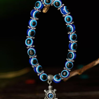 Blue Evil Eye Beaded Stretch Bracelet With A Turtle Charm
